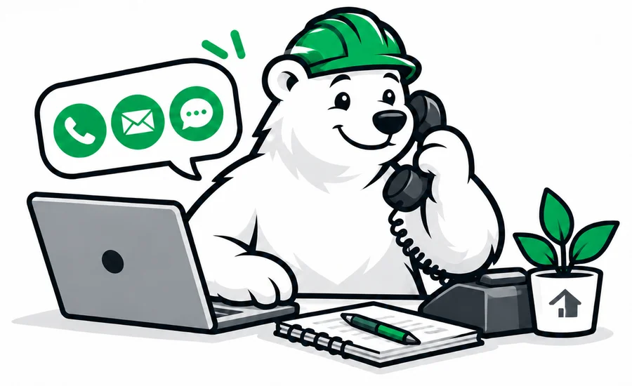 PermitNorth's polar bear mascot in a green hard hat, answering the phone at a desk with a laptop and notepad